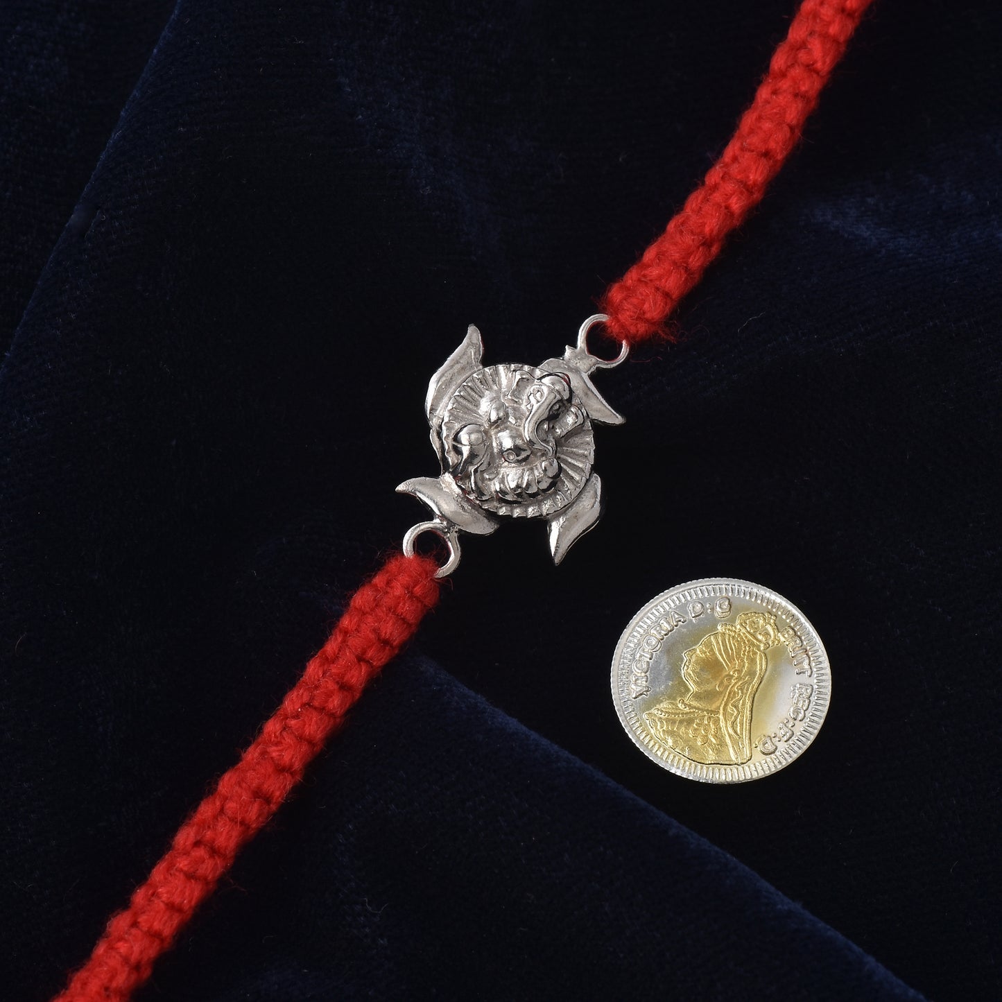 Ganpati Swastik Rakhi Charm: Spiritual Shine