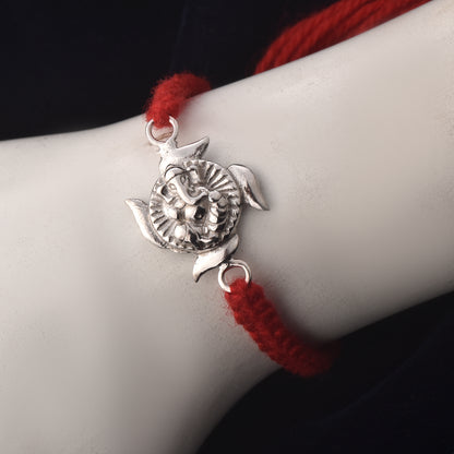 Ganpati Swastik Rakhi Charm: Spiritual Shine